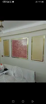 a room with two windows and a white fan at الأقصر الضبعيه in Al Baghdādī