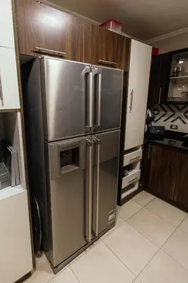 a kitchen with a large stainless steel refrigerator at Aswan Heritage Residence-Nile View and Free Airport Pickup in Aswan