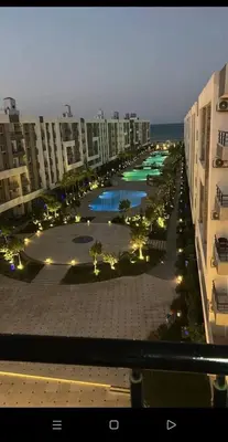 an aerial view of a city with buildings and a pool at Fanadir bay Al Ahyaa in Hurghada