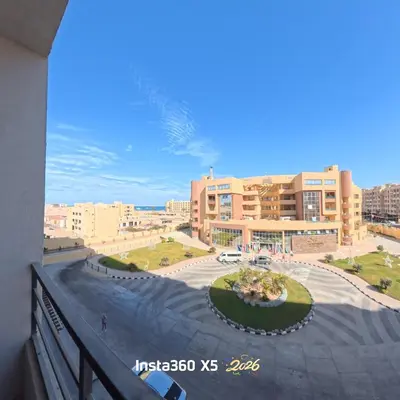 a view from a balcony of a city with buildings at New chalet with sea view and private beach access 82m in Hurghada