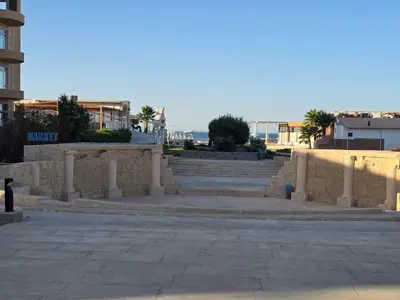 a stone retaining wall with stairs and the beach at See view Studio-Hurghada Selena Bay Resort in Hurghada