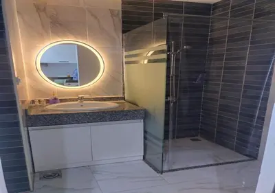 a bathroom with a sink and a shower with a mirror at See view Studio-Hurghada Selena Bay Resort in Hurghada