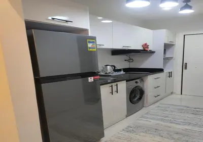 a kitchen with a stainless steel refrigerator and a dishwasher at See view Studio-Hurghada Selena Bay Resort in Hurghada