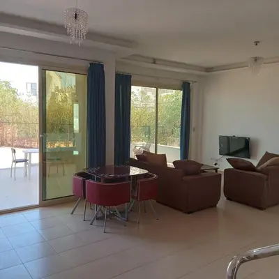 a living room with a couch and a table at George Villa in Hurghada