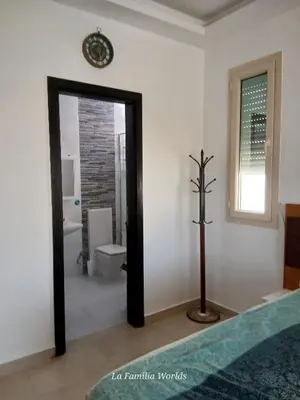 a room with a bathroom with a toilet and a mirror at Holiday Villa in Hurhgada Egypt in Hurghada