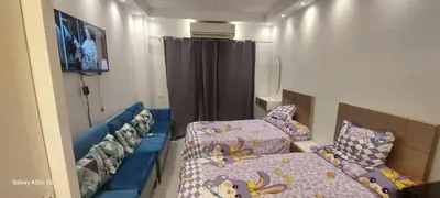 a small room with a bed and a couch at كمبوند فلورنزا خمسين عرابيا in Hurghada