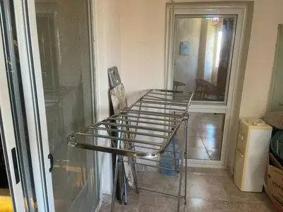 a metal cart in a room next to a door at Florenza Khamsin GH in Hurghada