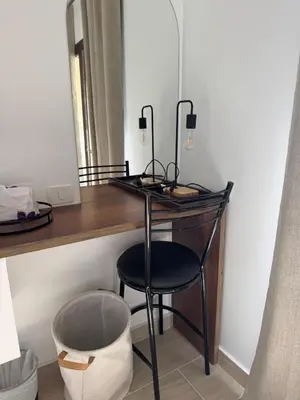 a black desk with a chair in a room at Aldau Heights Modern Serenity Studio in Hurghada