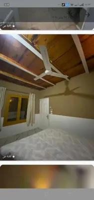 two pictures of a bed in a room at Home of Natural in Luxor