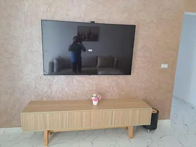 a person taking a picture of a tv screen at Amazing Apartment in Fanadir Hotel with Nice View F408 in Hurghada