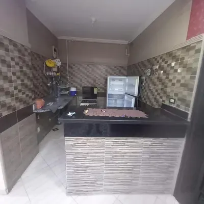 a kitchen with a counter top and a microwave at شقه للايجار اليومي بمدينة الغردقه مميزة جدا in Hurghada