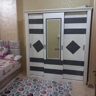 a room with a door with a mirror and a bed at شقه للايجار اليومي بمدينة الغردقه مميزة جدا in Hurghada