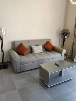 a living room with a couch and a coffee table at One B2b Apartment w balcony with Jacuzzi at Makadi Heights in Hurghada