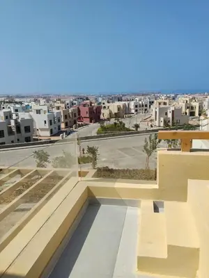 a view of a city from the roof of a building at One B2b Apartment w balcony with Jacuzzi at Makadi Heights in Hurghada