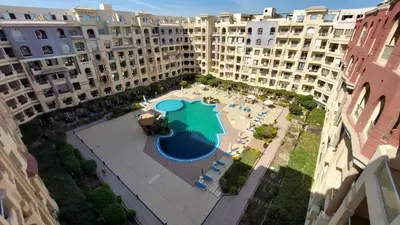 an aerial view of a large apartment complex with a swimming pool at Florenza Khamsim 307 in Hurghada