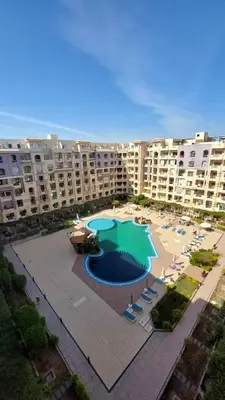 an aerial view of a large swimming pool in a resort at Cozy studio in Florenza Khamsim - I409 in Hurghada