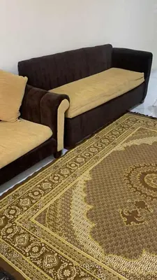 a couch and a rug in a living room at Sun live Holiday in Hurghada