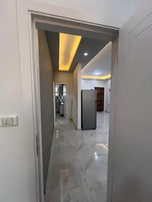 a hallway with a refrigerator in a room at Modern Beachfront Apartment 2 in Hurghada