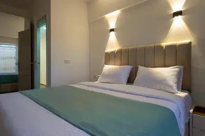 a bedroom with a large bed with two white pillows at Al Saraya Sahl Hasheesh by Peaks 1 Bed Apartment with Pool View C116 in Hurghada