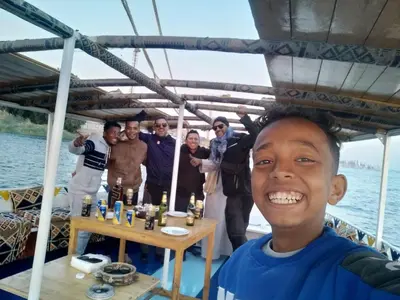 a man on a boat with a group of people at Mary sailboat adventure in Luxor