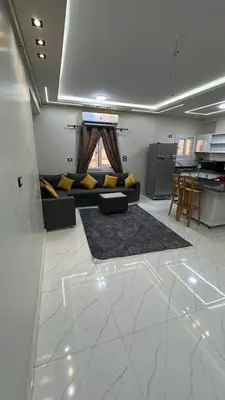 a living room with a couch and a table at Elite Apartment Hurghada in Hurghada
