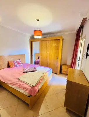 a bedroom with a bed in a room at Elegant 2BR Retreat in Secure Resort Community in Hurghada