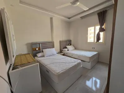 a bedroom with two beds and a window at Redsea - Hrghada - Arabia in Hurghada