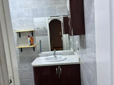 a bathroom with a sink and a mirror at Waleed in Hurghada