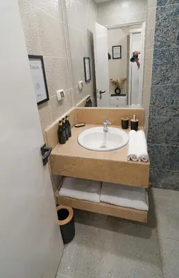 a bathroom with a sink and a mirror at nile view modern studio- 7 min from aswan station in Aswan
