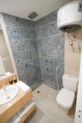 a bathroom with a toilet and a sink at nile view modern studio- 7 min from aswan station in Aswan