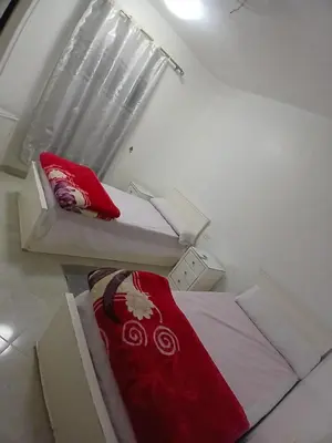 two beds sitting next to each other in a room at عرابيا امام فندق بيروت بجوار سوبر ماركت الخضري in Hurghada