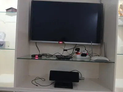 a flat screen tv sitting on a shelf at عرابيا امام فندق بيروت بجوار سوبر ماركت الخضري in Hurghada