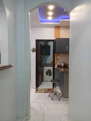 a room with a kitchen with a blue ceiling at الشيراتون شارع السنترال السياحي in Hurghada