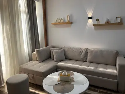 a living room with a couch and a table at Royal Club Residence in Port Ghalib