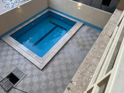 an overhead view of a swimming pool in a house at Two Bedroom Apartment in Hurghada
