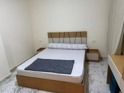 a bedroom with a bed in a room at Two Bedroom Apartment in Hurghada