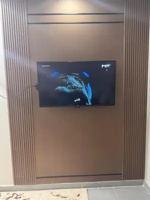 a flat screen tv hanging on a wall at Scandic Resort A531 in Hurghada