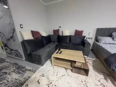 a living room with a couch and a coffee table at Scandic Resort A531 in Hurghada