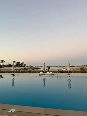 a pool of water with statues in the middle at Scandic Resort A531 in Hurghada