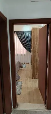 a view of a hallway with a door and a room at 2 bedroom apartment Bay View sahl hasheesh in Hurghada