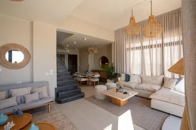 a living room with a couch and a table at Chic Cyan 4BR Villa with Private Pool in Hurghada