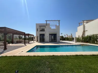 a house with a swimming pool in the yard at Chic Cyan 4BR Villa with Private Pool in Hurghada