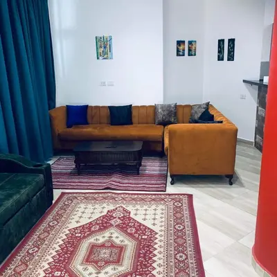 a living room with a couch and a rug at Princess resort Hurghada in Hurghada