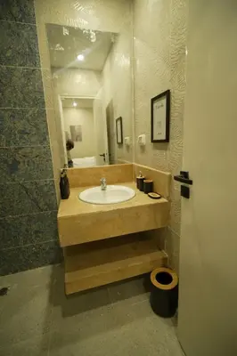 a bathroom with a sink and a mirror at modern studio- 7 min from aswan station in Aswan