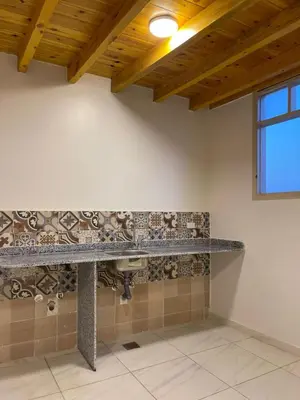 a bathroom with a stone counter and a sink at in luxor apartment in Luxor