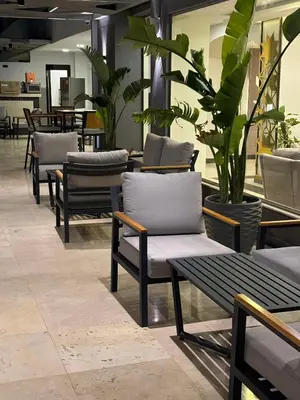 a row of chairs and tables in a restaurant at Fanadir Bay Resort Canary Apartman in Hurghada