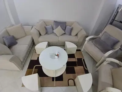a living room with a couch and a table at شقه مميزه في عرابيا الغردقه امام فندق بيروت in Hurghada
