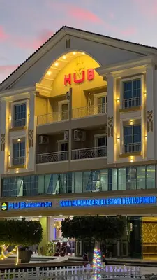a large building with a hko sign on it at Hurghada Hub Resort in Hurghada