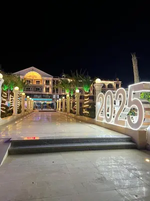 a sign that says on the side of a building at Hurghada Hub Resort in Hurghada