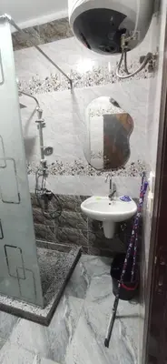a bathroom with a sink and a mirror at الغردقة شارع مترو in Hurghada